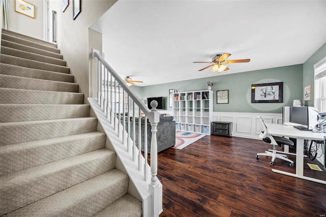 interior space with ceiling fan and dark hardwood / wood-style floors