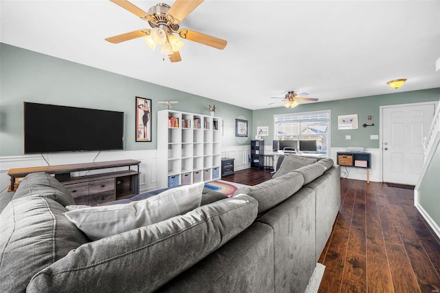 living room with ceiling fan and dark hardwood / wood-style flooring