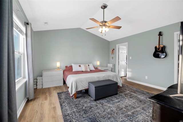 bedroom featuring lofted ceiling, ceiling fan, and hardwood / wood-style flooring