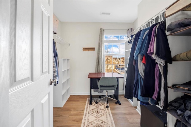 walk in closet featuring light wood-type flooring