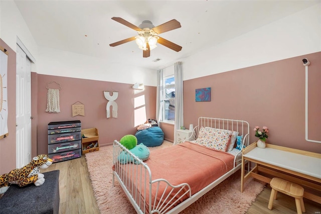 bedroom featuring hardwood / wood-style flooring and ceiling fan