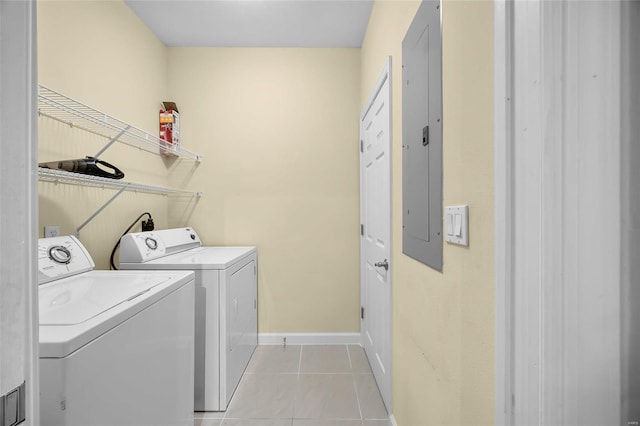 laundry room featuring light tile patterned floors, independent washer and dryer, and electric panel