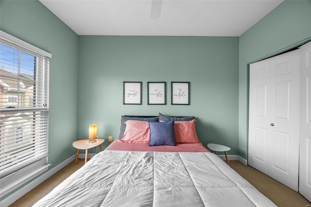 bedroom featuring carpet flooring, a closet, and ceiling fan