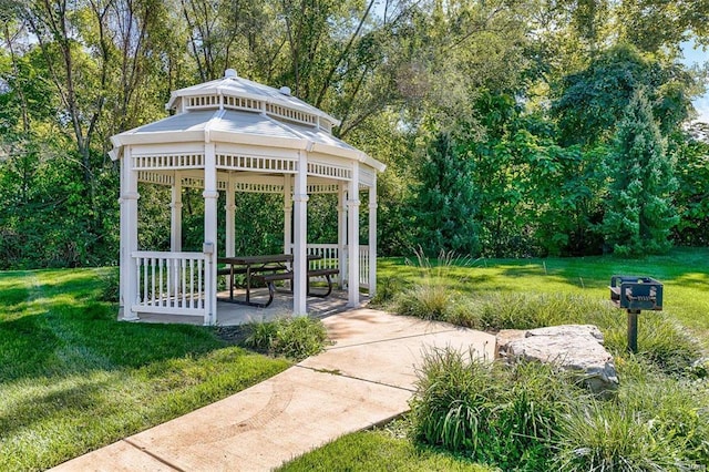 view of community with a gazebo and a yard