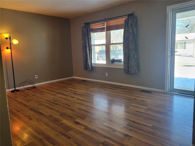 empty room featuring dark hardwood / wood-style floors