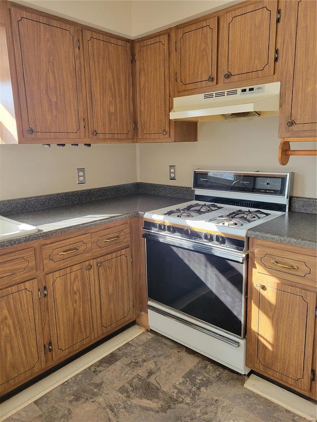 kitchen with white range with gas cooktop