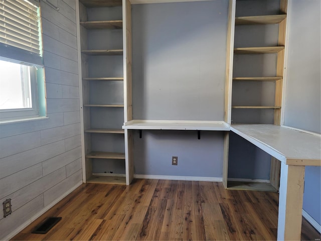 unfurnished office featuring dark wood-type flooring