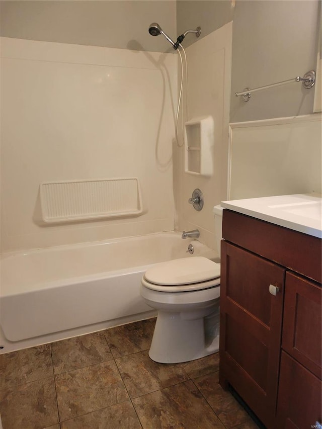 full bathroom featuring toilet,  shower combination, and vanity