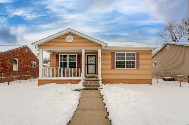 view of front of property with central AC unit and covered porch