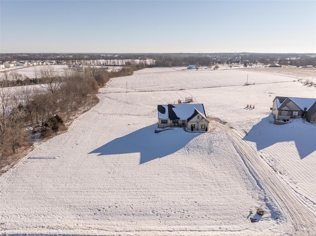 snowy aerial view featuring a rural view