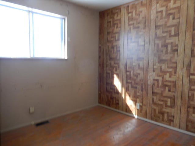 empty room featuring wood-type flooring