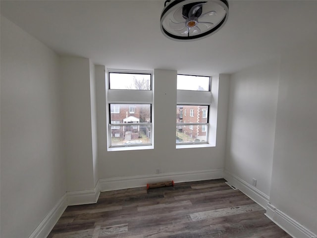 spare room featuring dark hardwood / wood-style flooring