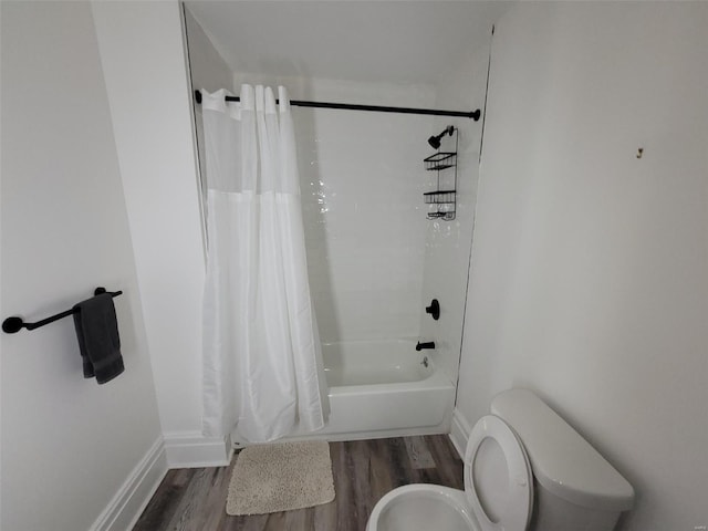 bathroom featuring hardwood / wood-style floors, toilet, and shower / bath combo