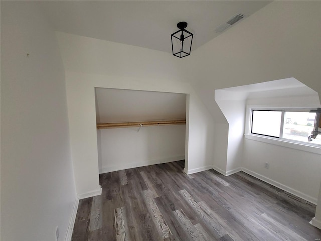 bonus room with dark hardwood / wood-style flooring