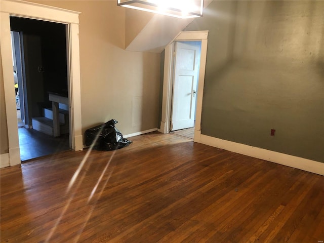 bonus room featuring dark wood-type flooring