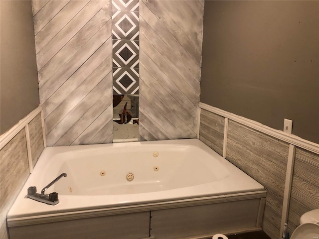 bathroom with a tub to relax in