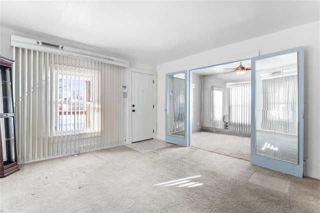 interior space featuring ceiling fan