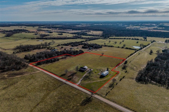 birds eye view of property featuring a rural view