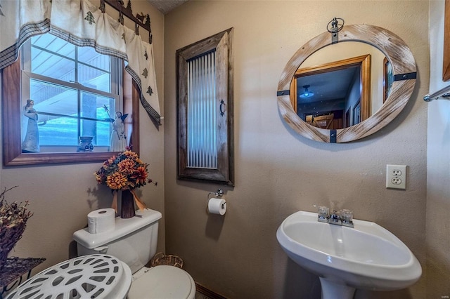 bathroom with toilet and sink