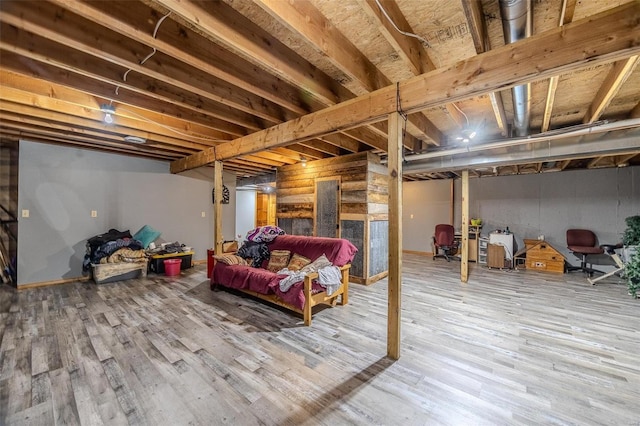 basement featuring hardwood / wood-style floors