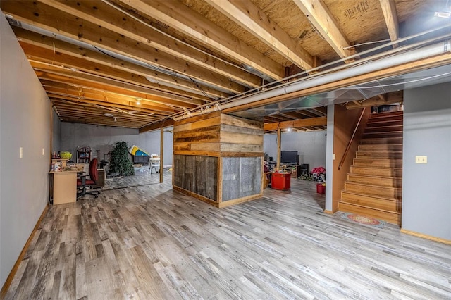 basement featuring hardwood / wood-style flooring