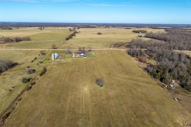 birds eye view of property with a rural view