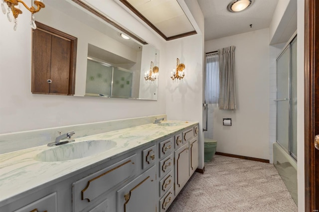 full bathroom with combined bath / shower with glass door, vanity, and toilet