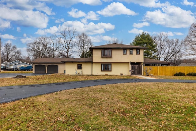 view of front property with a garage and a front lawn