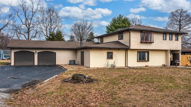 view of front facade with a front lawn and a garage