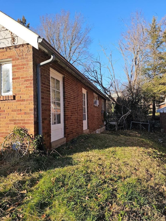 view of home's exterior featuring a yard