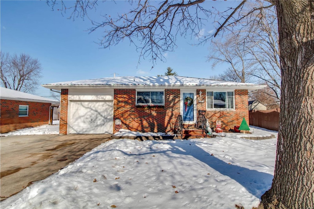 single story home featuring a garage