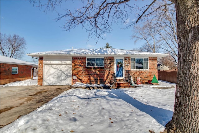 single story home featuring a garage