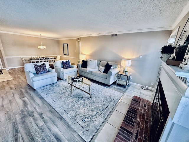 living room with a textured ceiling and ornamental molding