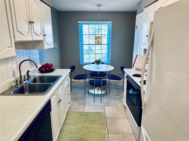 kitchen with white appliances, white cabinets, decorative light fixtures, and sink