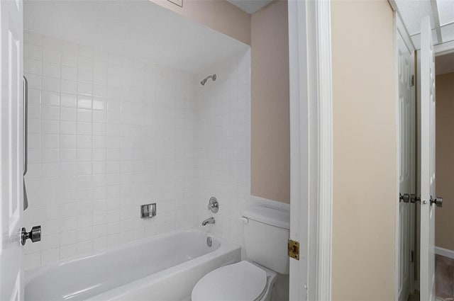 bathroom featuring toilet and shower / washtub combination