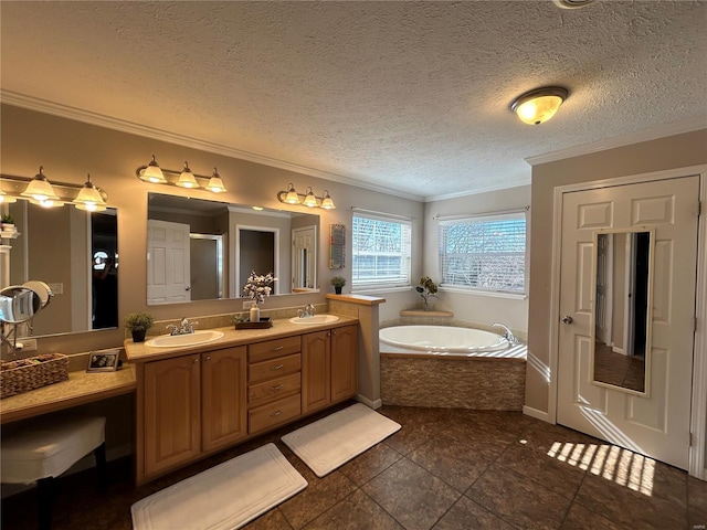 bathroom with ornamental molding, independent shower and bath, vanity, and a textured ceiling