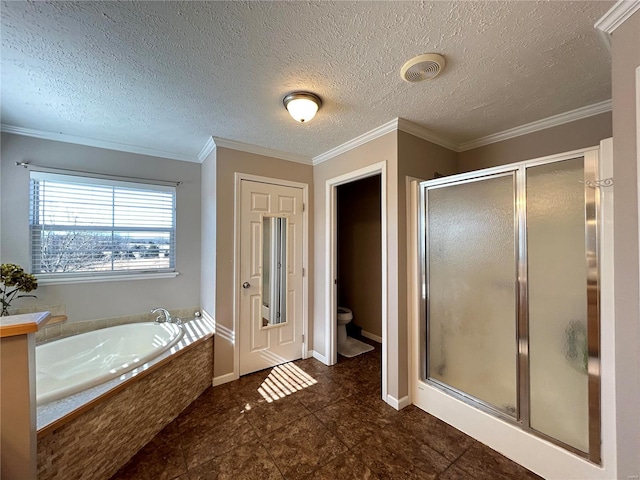 bathroom featuring ornamental molding, toilet, separate shower and tub, and a textured ceiling