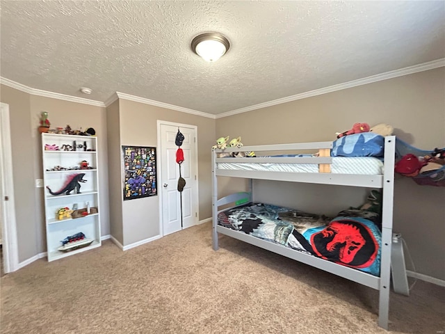 bedroom with crown molding, carpet floors, and a textured ceiling