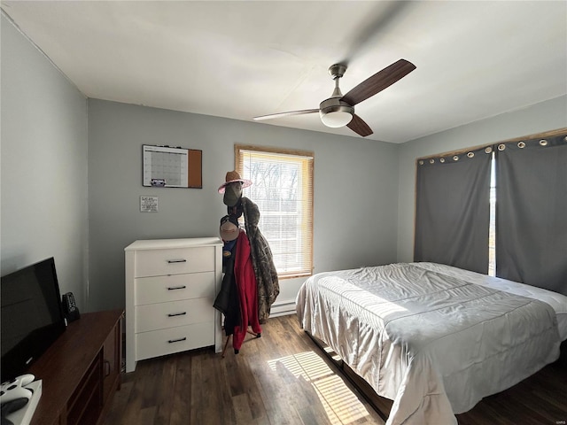 bedroom featuring dark wood-type flooring and ceiling fan