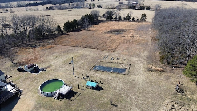 birds eye view of property featuring a rural view