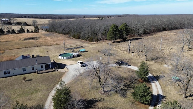 birds eye view of property with a rural view