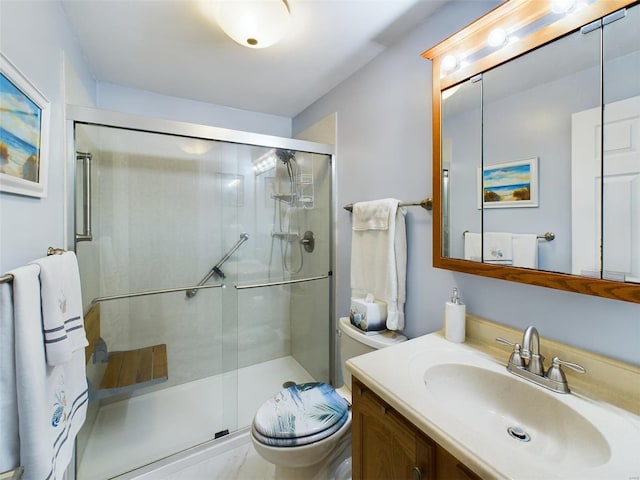 bathroom with toilet, walk in shower, and vanity