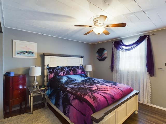 bedroom featuring ceiling fan and dark hardwood / wood-style floors