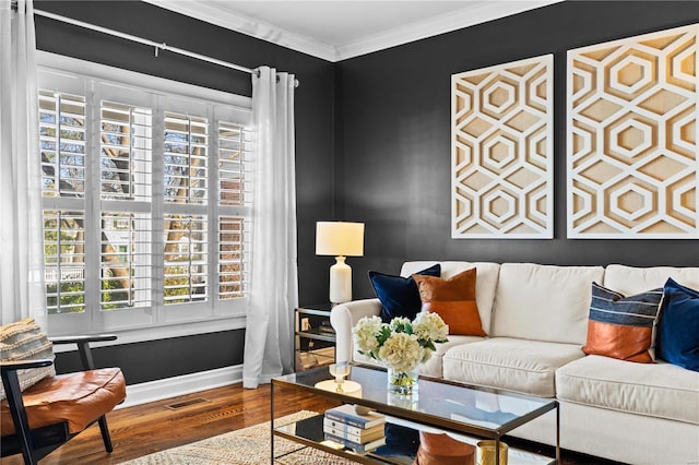 living room with hardwood / wood-style floors and crown molding