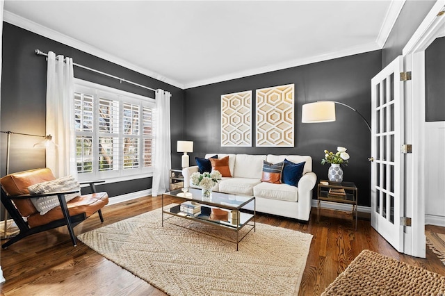 living room with ornamental molding, dark wood-type flooring, and french doors