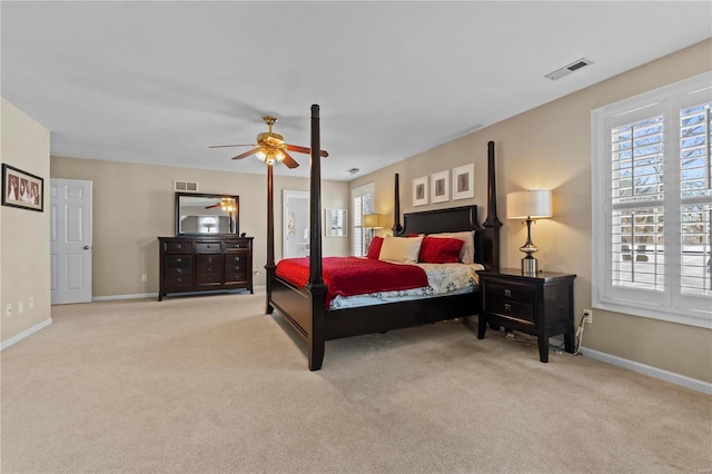 bedroom featuring ceiling fan and light carpet