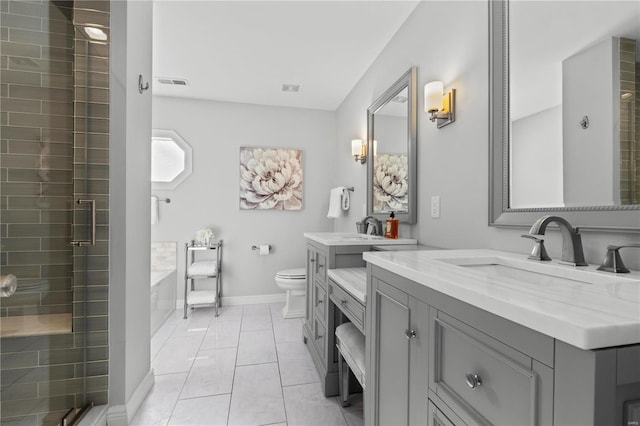 full bathroom featuring toilet, tile patterned flooring, shower with separate bathtub, and vanity