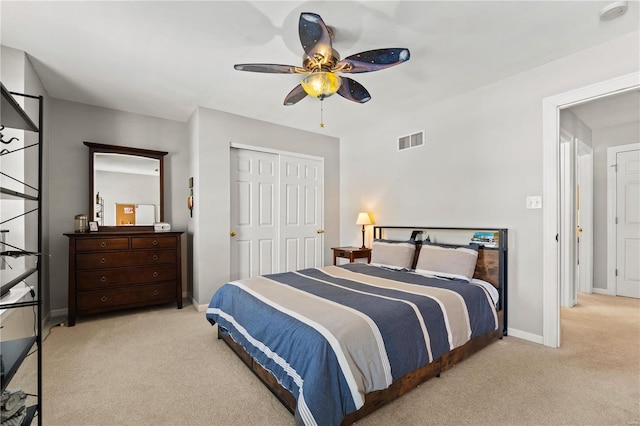 bedroom with light carpet, a closet, and ceiling fan