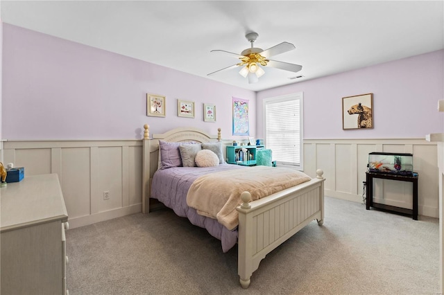 bedroom featuring ceiling fan and light carpet