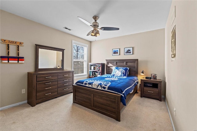 bedroom with light colored carpet and ceiling fan